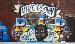 Figure 1.  This striking image of a mural dedicated to Mike Brown is one of the items added to the Documenting Ferguson collection.  http://omeka.wustl.edu/omeka/items/show/8736 