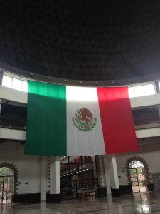 Image 4.  The central foyer of the Archivo General de la Nación, with a massive dome in the place of the old prison watchtower and the Mexican flag centrally positioned as one enters the space (taken by the author in 2015).