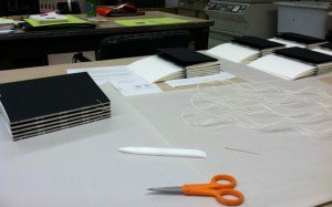 Binding an edition of artists’ books.